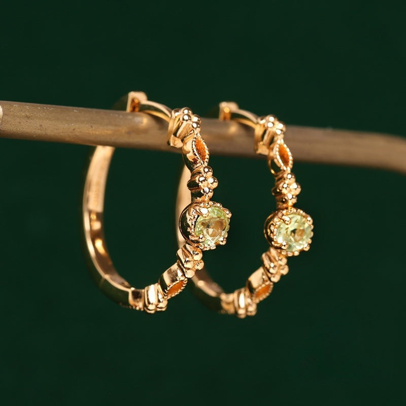 [Qinglu] S925 sterling silver gold-plated olive green zircon earrings French temperament high-end twist earrings for women